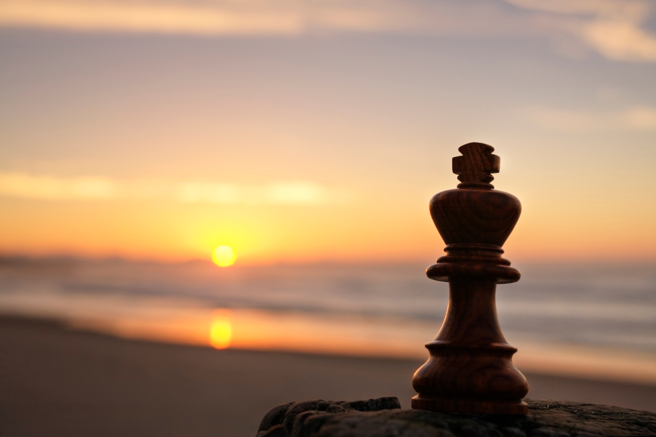 Chess King on Beach at Sunrise